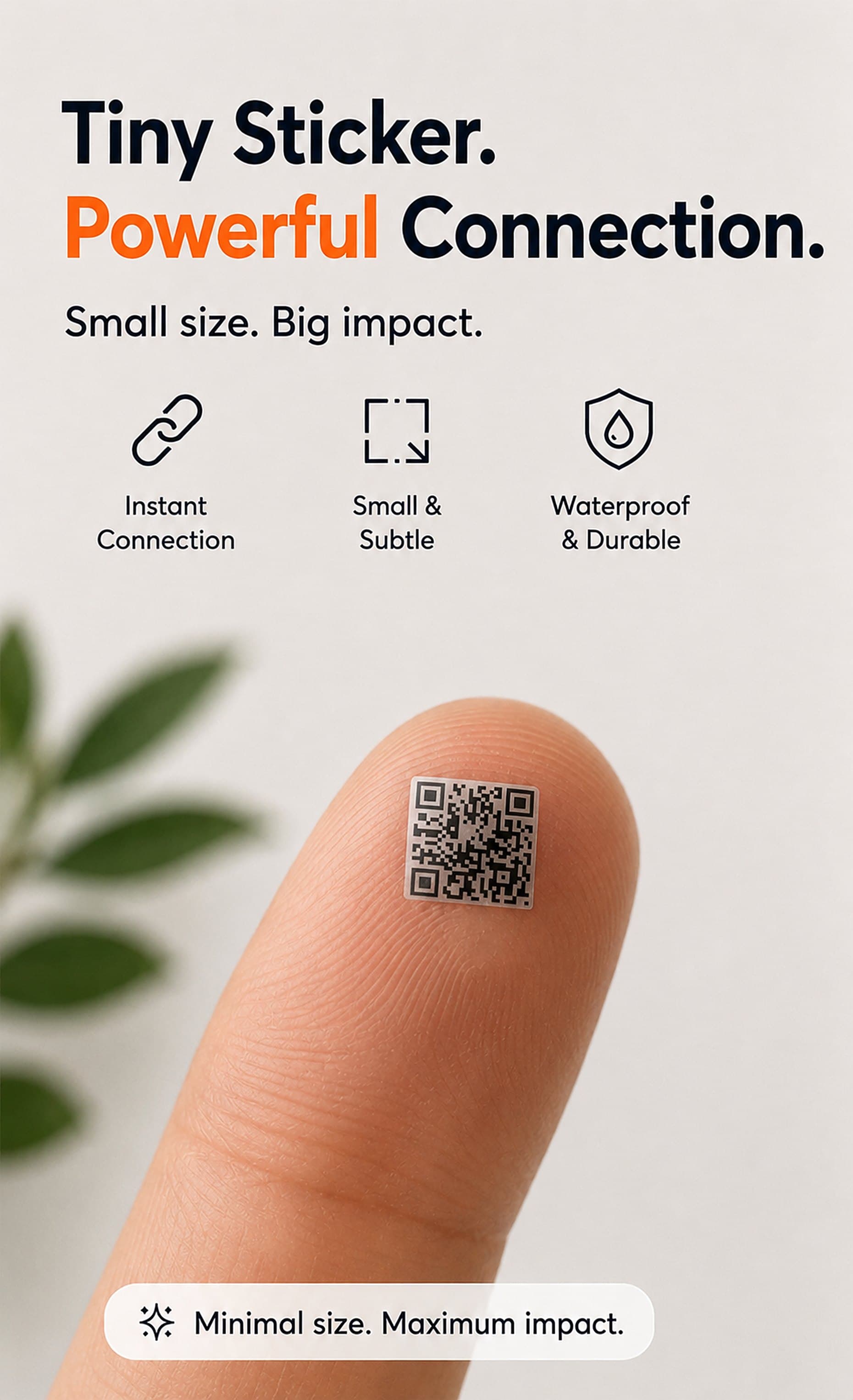 A tiny QR sticker balanced on a fingertip, smaller than the fingerprint behind it